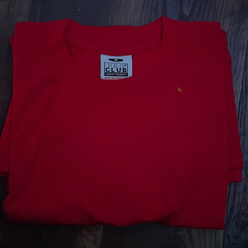 size medium, red pro club shirt, never been worn before